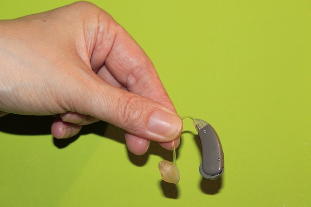 hand holding hearing aid